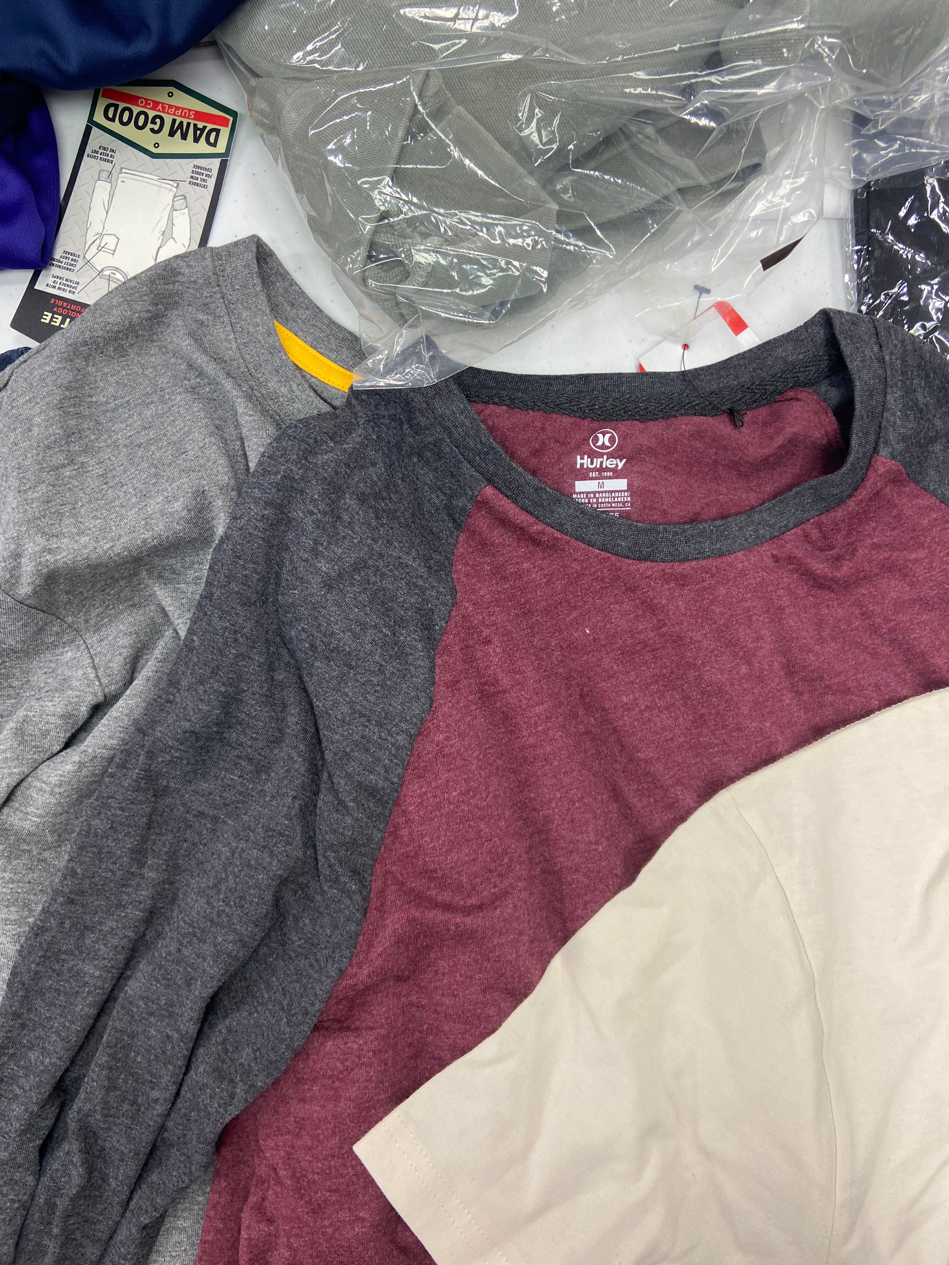 Men's Clothing Tops Wholesale Lot, ADIDAS, CALVIN KLEIN, HURLEY, HANG TEN, DAM GOOD, CATERPILLAR, AMERICAN APPAREL, 27 items, Shelf Pulls, MSRP $871